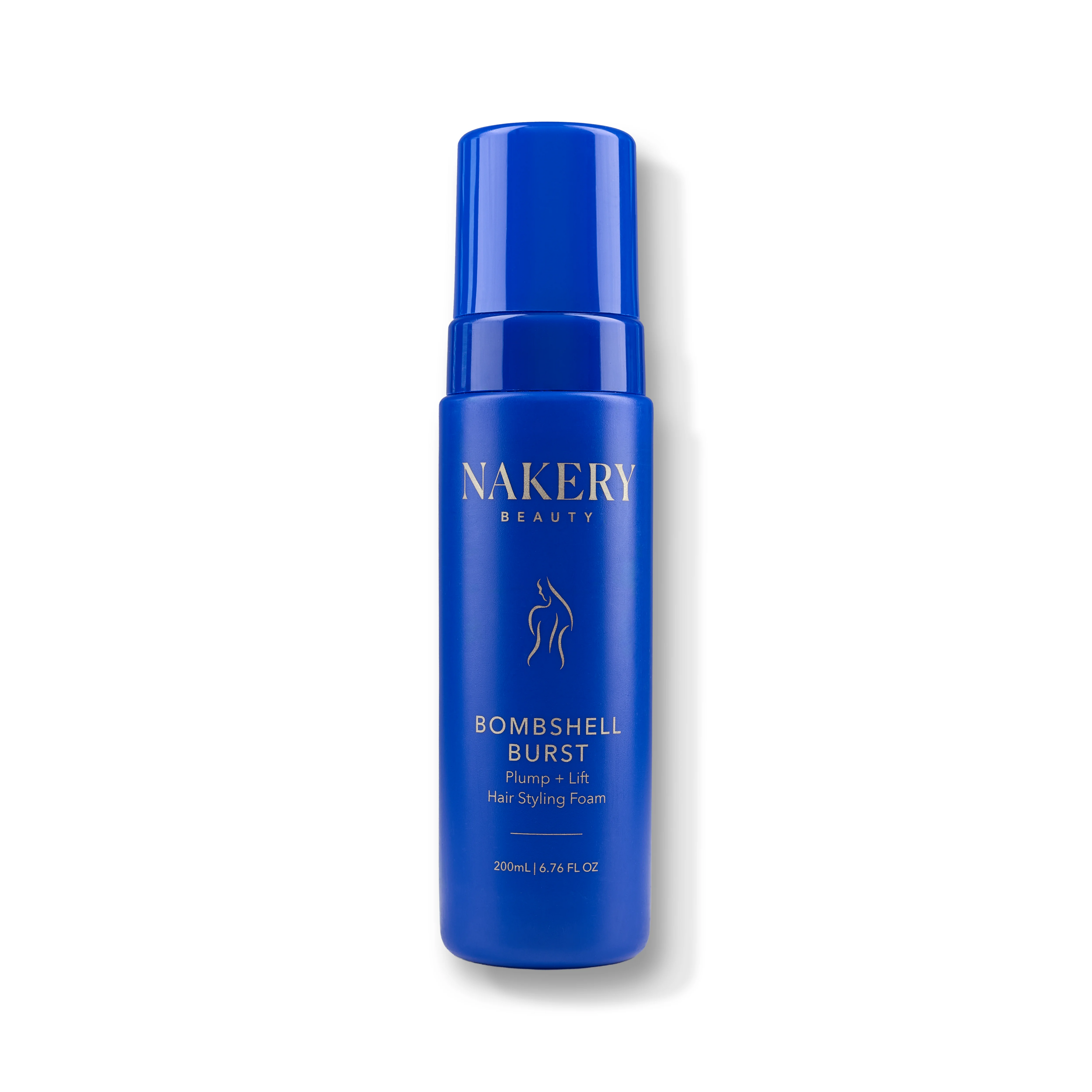 A blue cylindrical pump bottle of NAKERY BEAUTY Bombshell Burst Pump + Lift Hair Styling Foam, shown on a clean white background with a soft shadow.