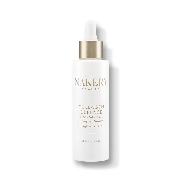 A white skincare bottle with a gold collar and white dropper cap &